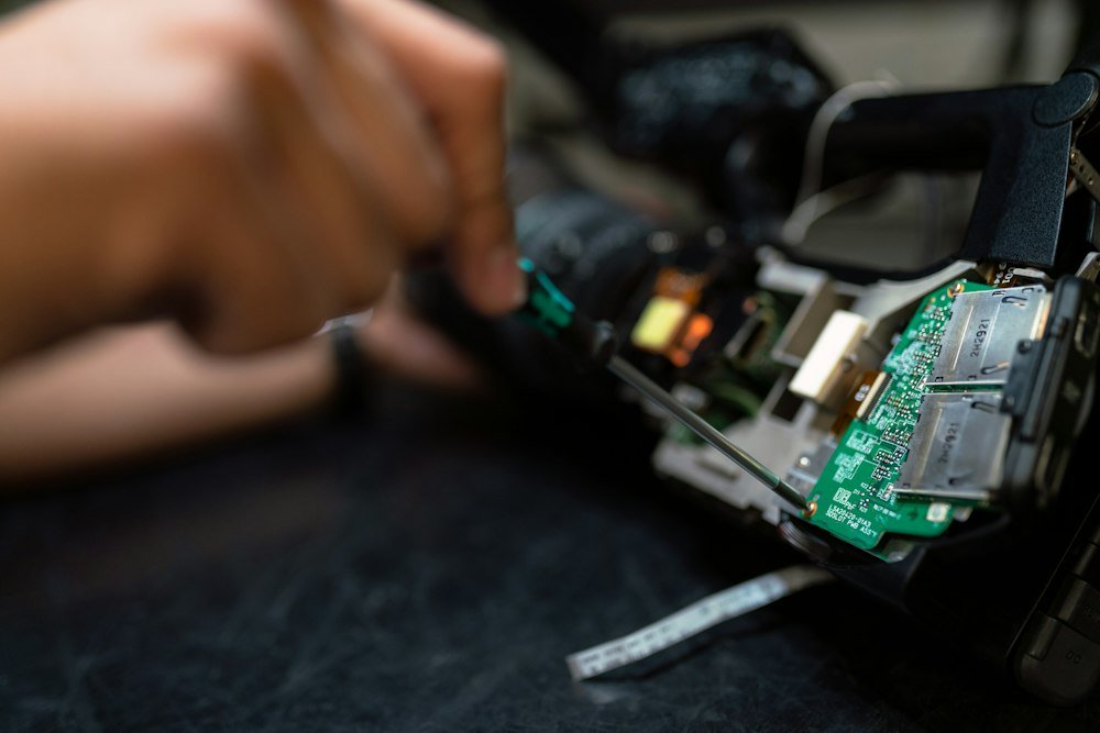 Dedicated service technician holding multimeter ready for diagnostics